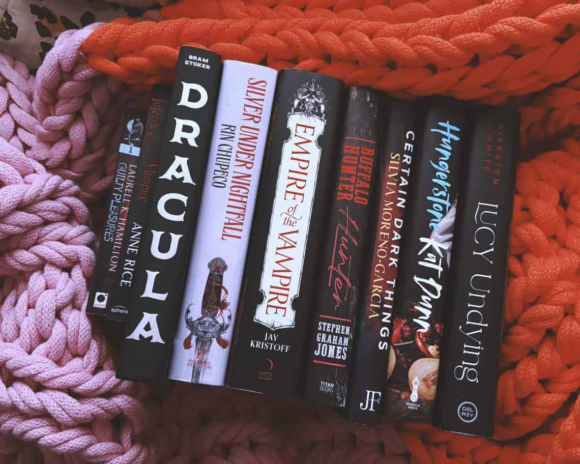 9 vampire books on a chunky blanket