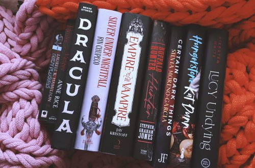9 vampire books on a chunky blanket