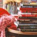 12 books stacked on a side table