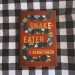 Snake Eater by T Kingfisher - Book Cover on a checkered surface